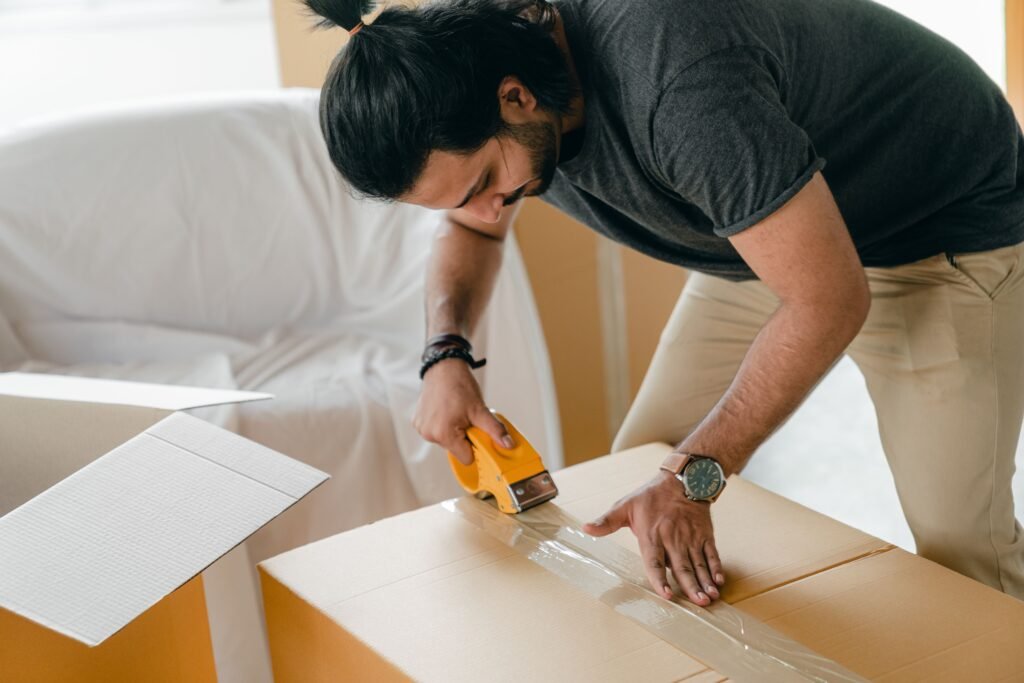 Professional movers wrapping furniture securely for transport in Dubai